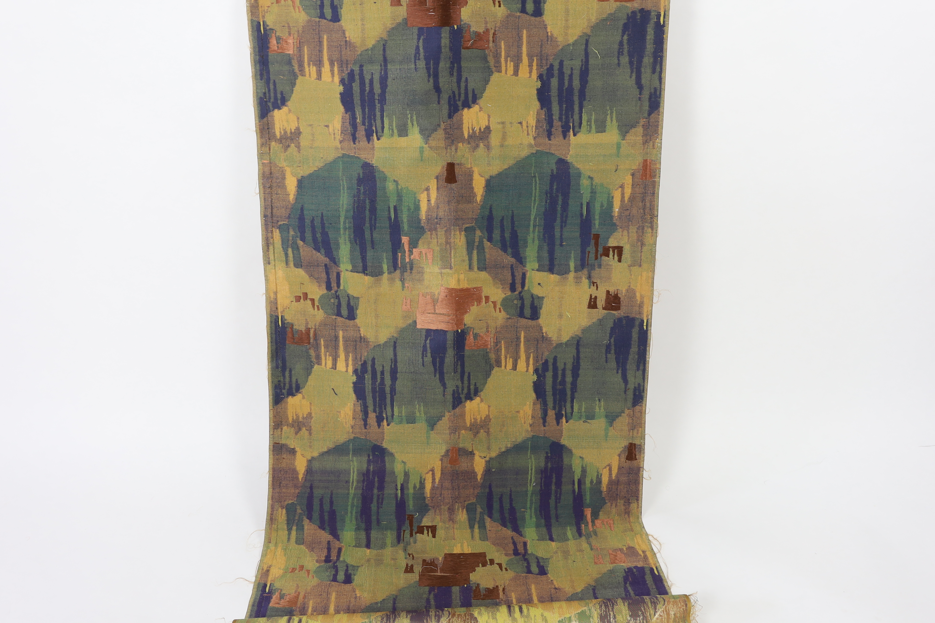 A 1930’s Japanese Kyoto, possibly Nishijin and a Tsumugi hand loomed brocade, woven in fine gold and multi coloured threads, in an abstracted mountainous landscape pattern, originally possibly woven for an Obi, 69cm wide